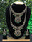 Bridal set with emerald & cz stones and beads hangings in victorian finish