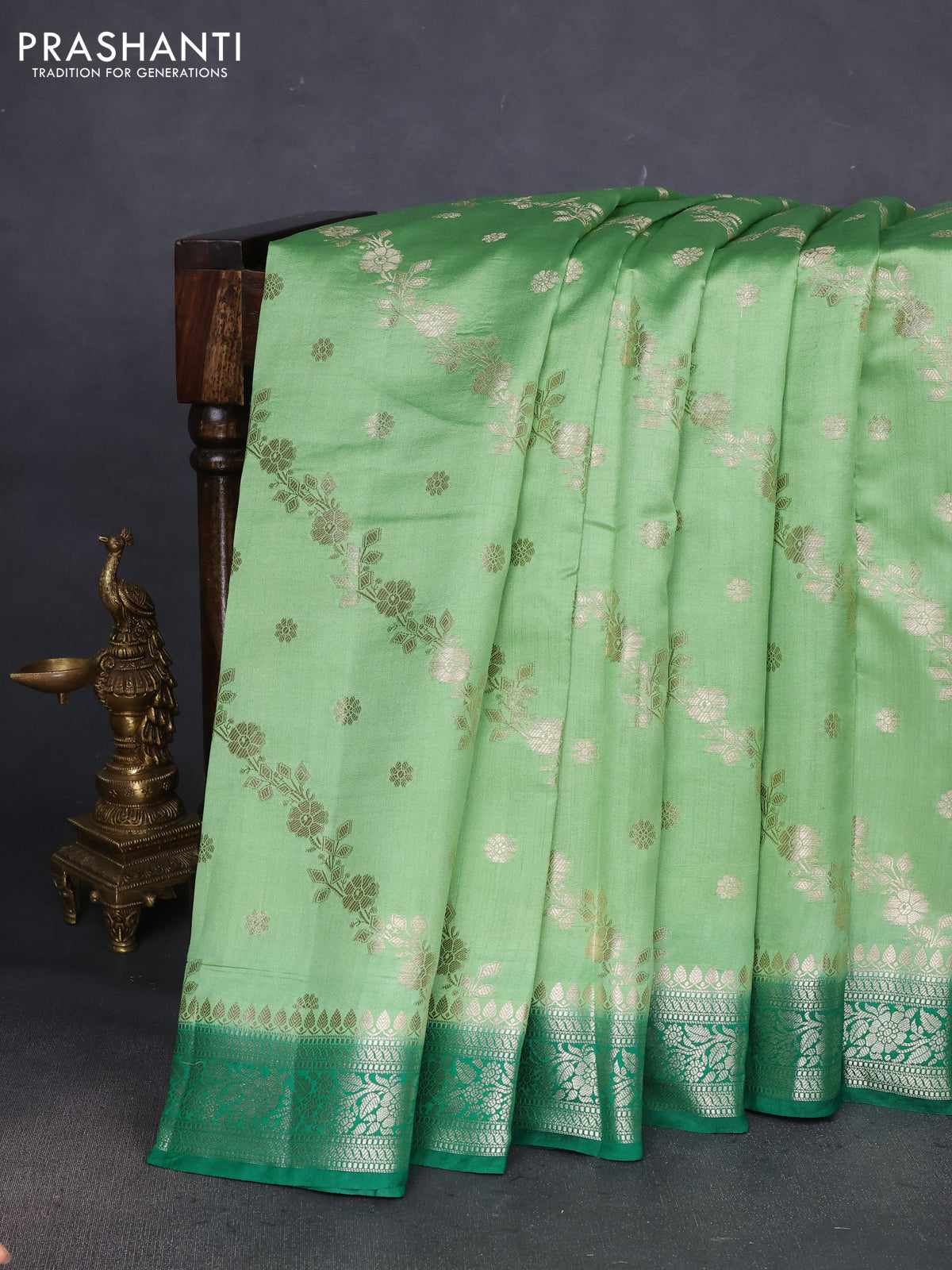 Chiniya silk saree light green and dark green with allover zari weaves and zari woven border