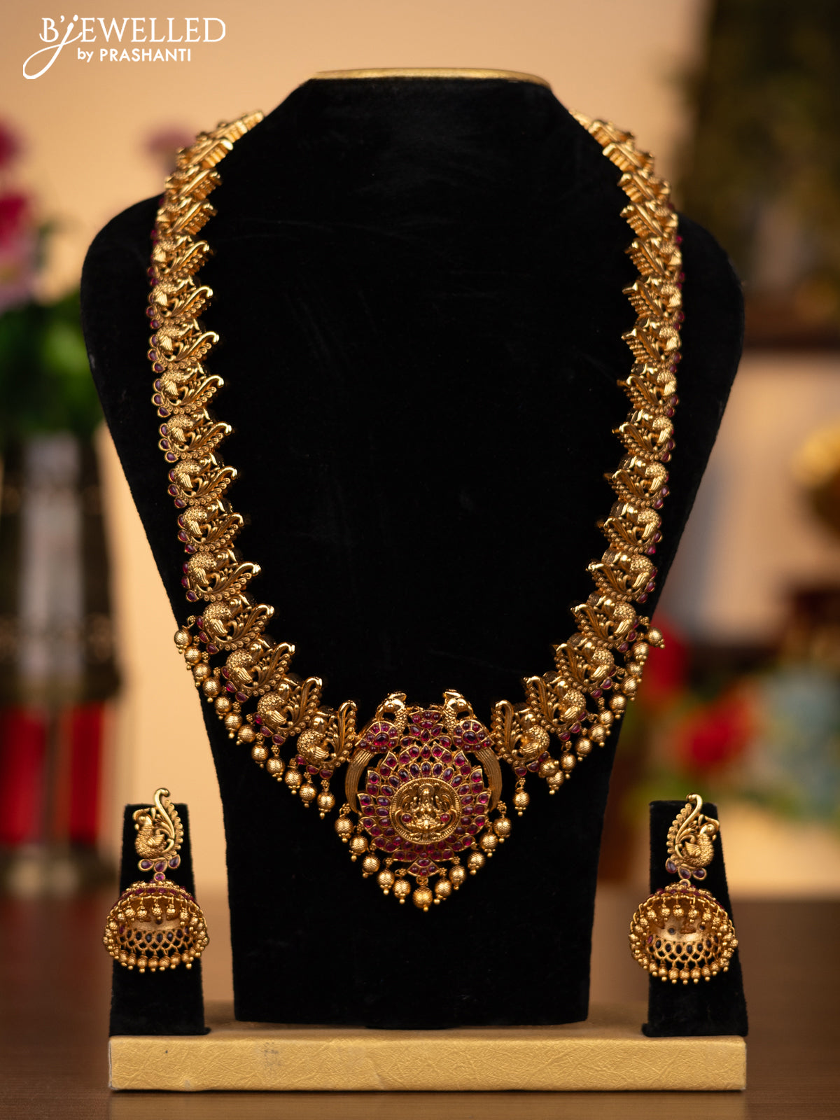 Antique haaram lakshmi & peacock design with pink kemp stones and golden beads hanging