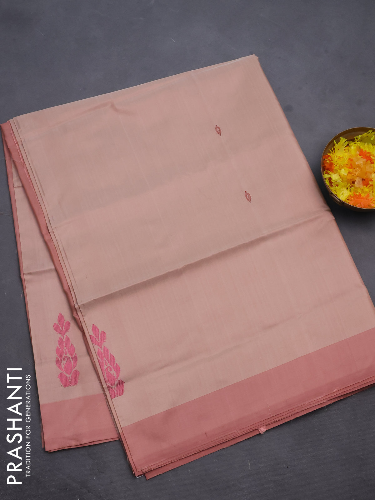 Banana pith saree sandal and pastel peach with thread woven buttas and contrast border