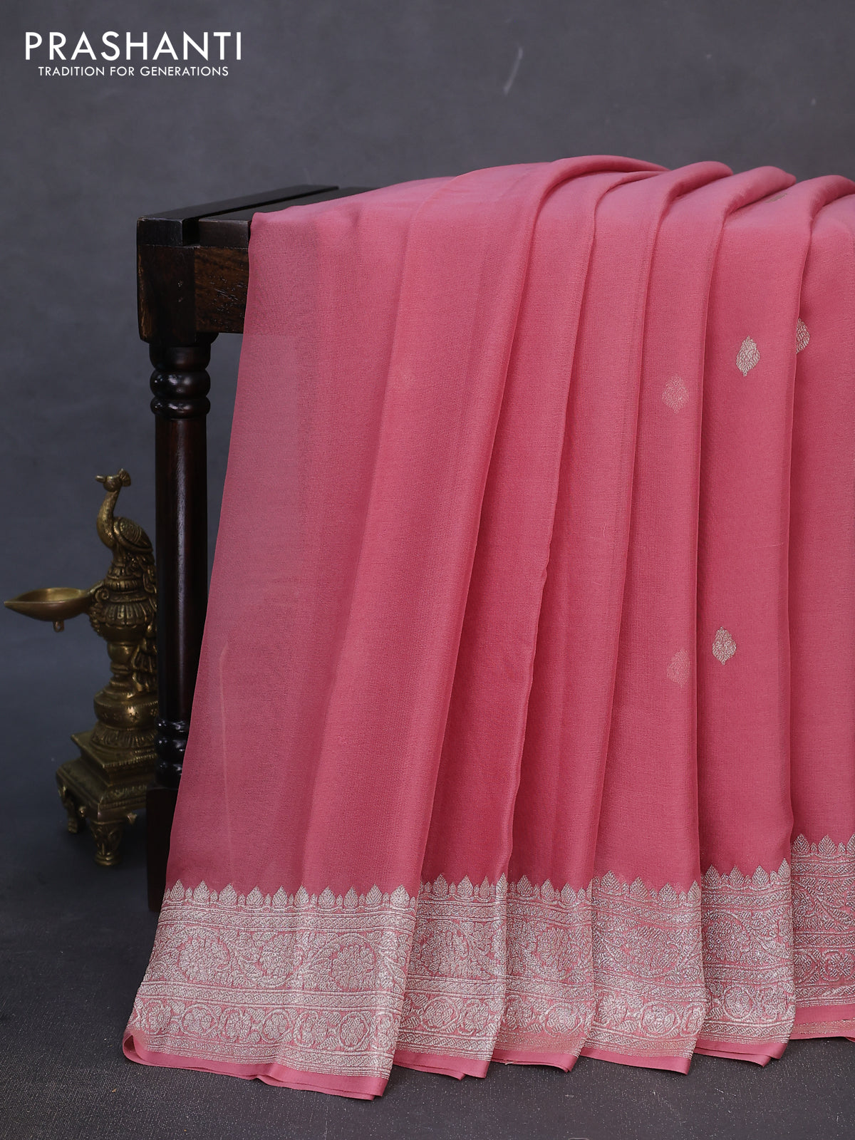 Banarasi chiffon silk saree peach shade with silver zari woven buttas and silver zari woven border
