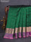 Pure kanchipuram silk saree dark green and dual shade of purple with allover zari woven buttas and rettapet zari woven border