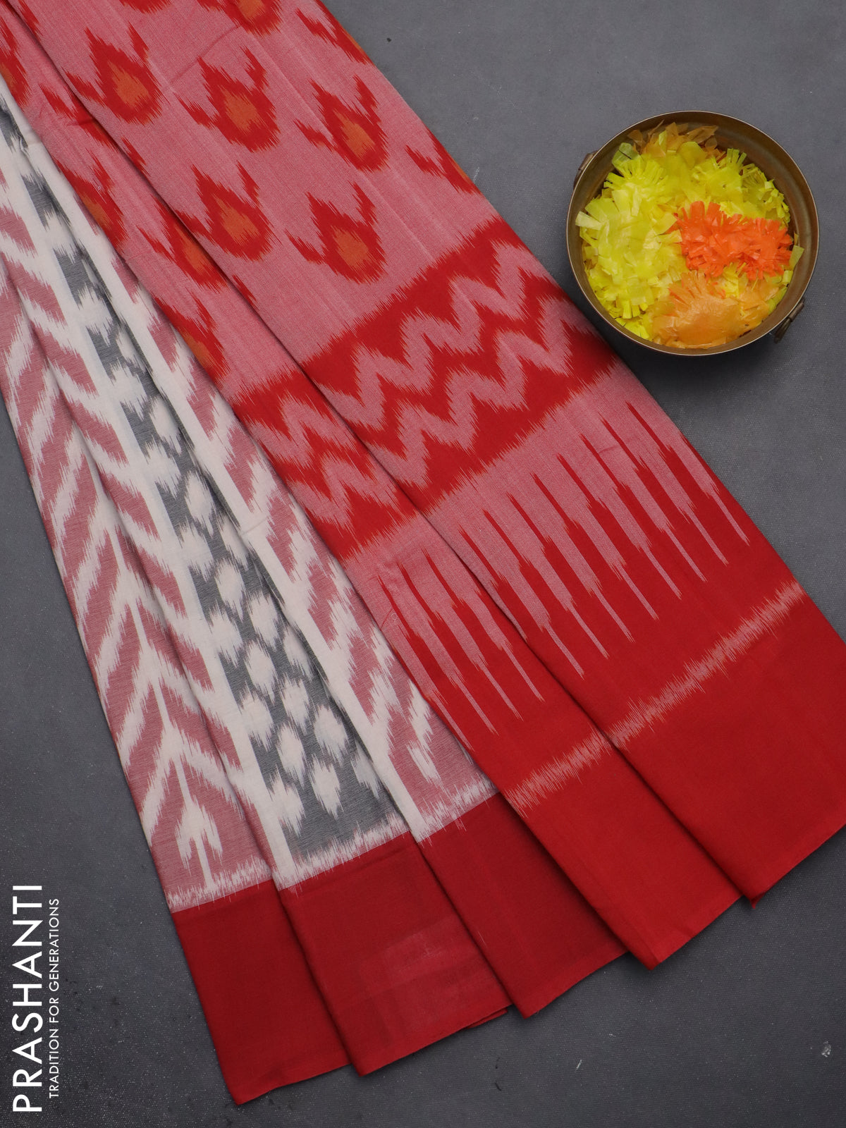 Ikat cotton saree off white and red with allover ikat weaves and simple border