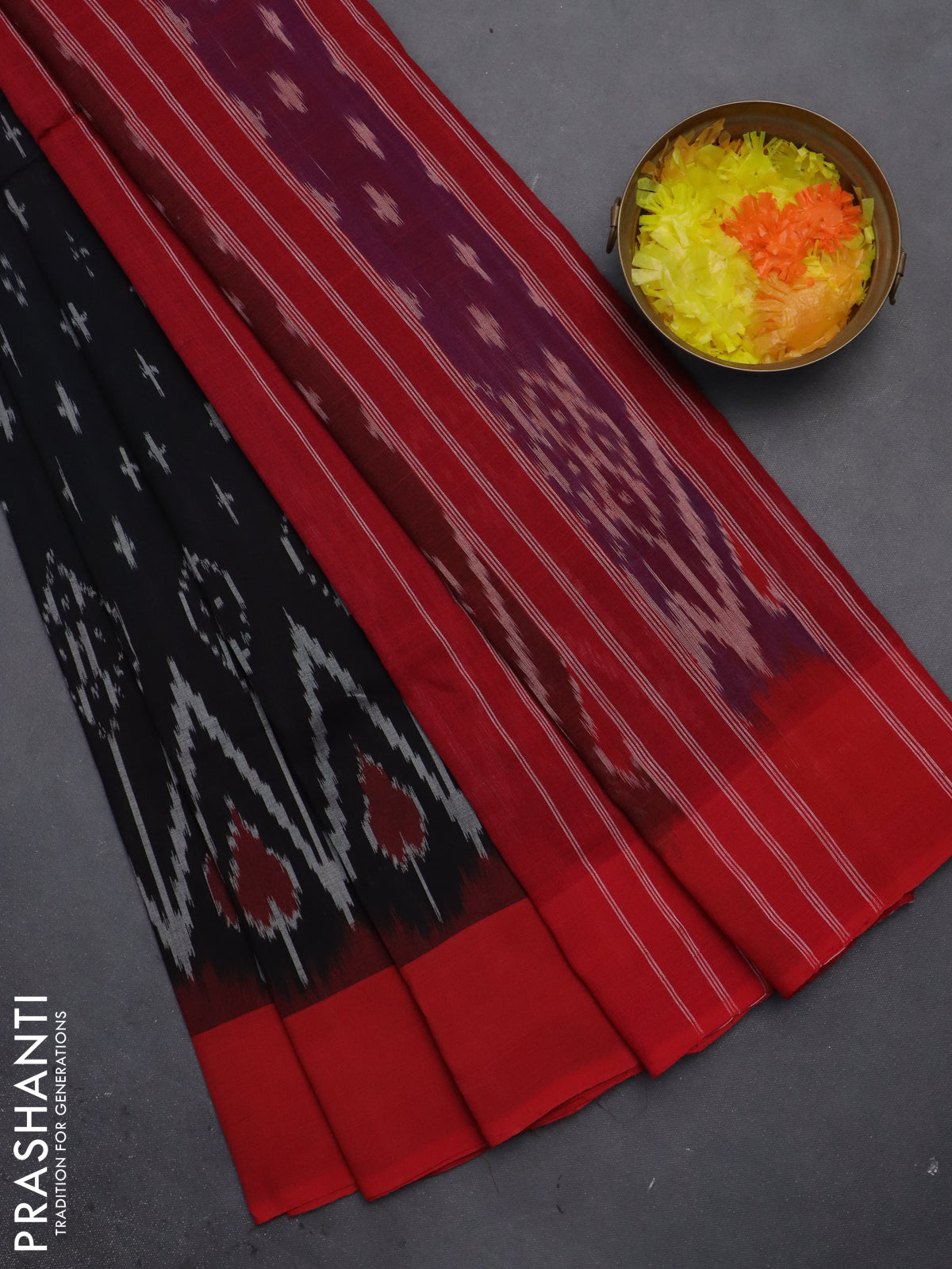 Ikat cotton saree black and red with allover ikat butta weaves and simple border