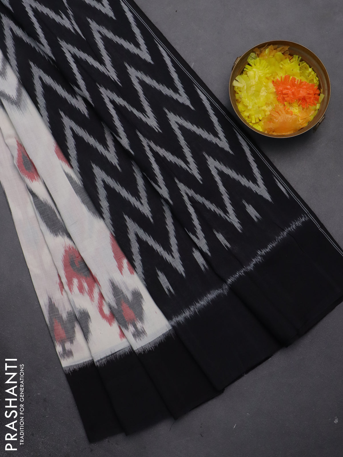 Ikat cotton saree off white and black with allover zig zag ikat weaves and long ikat style border