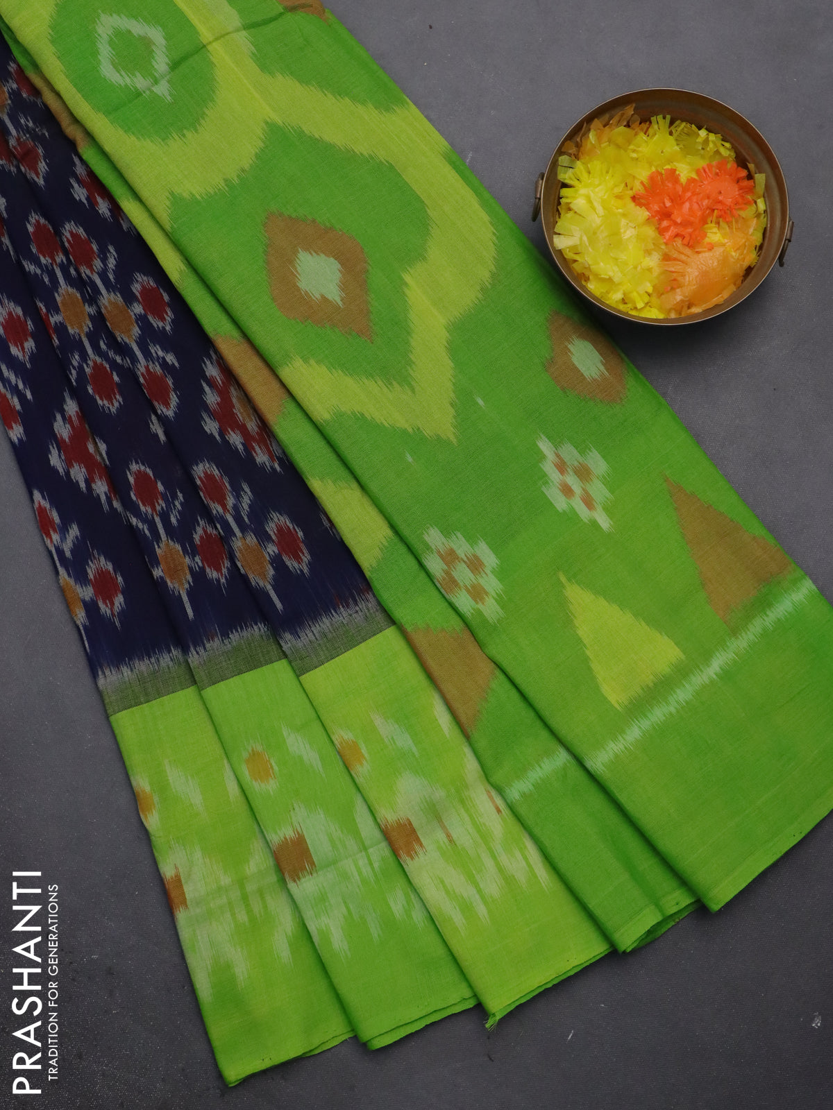 Ikat cotton saree navy blue and light green with allover ikat butta weaves and long ikat style border