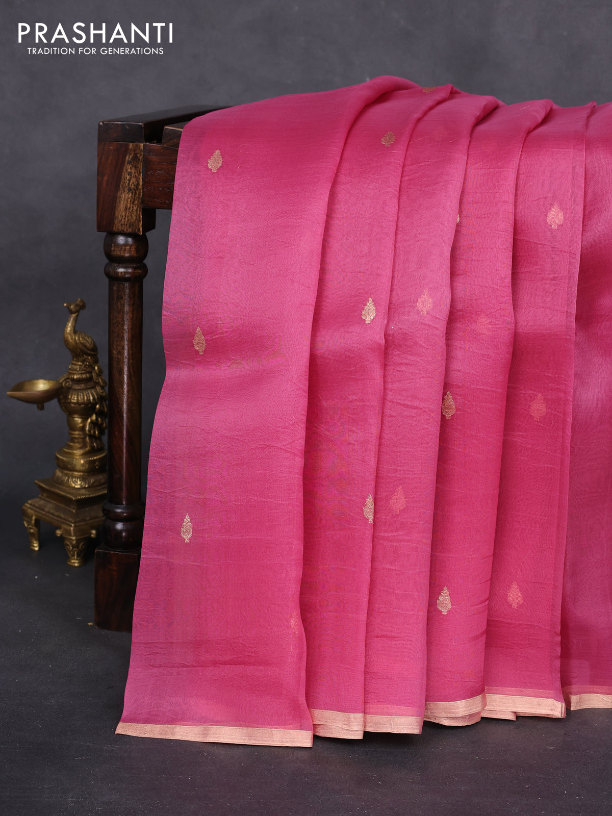 Banarasi organza silk saree pink shade with zari woven buttas and zari woven piping border