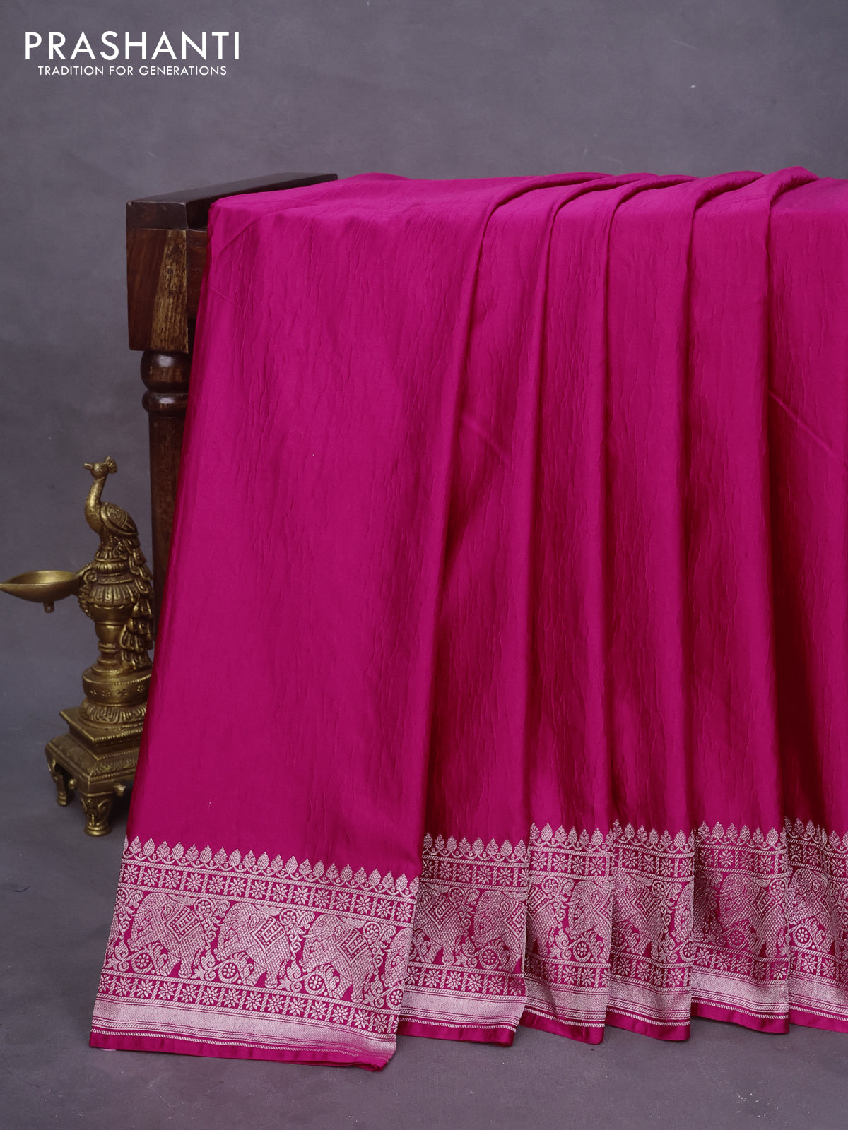 Banarasi crush crepe saree pink with plain body and silver zari woven elephant border