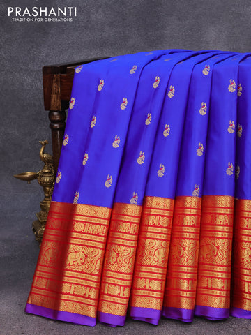 Pure gadwal silk saree blue and red with zari woven peacock buttas and long zari woven border