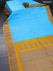 Pure gadwal silk saree light blue and mustard yellow with allover checked pattern and thread woven border