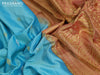 Pure gadwal silk saree light blue and rust shade with silver & gold zari woven parrot buttas and temple design long zari woven border