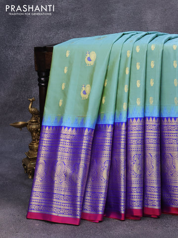 Pure gadwal silk saree light blue shade and blue with annam zari woven buttas and temple design long zari woven border
