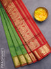 Silk cotton saree dual shade of green and kumkum red with allover self emboss jaquard and annam zari woven border