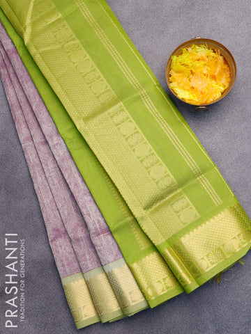 Silk cotton saree dual shade of purple and light green with allover self emboss jaquard and zari woven border