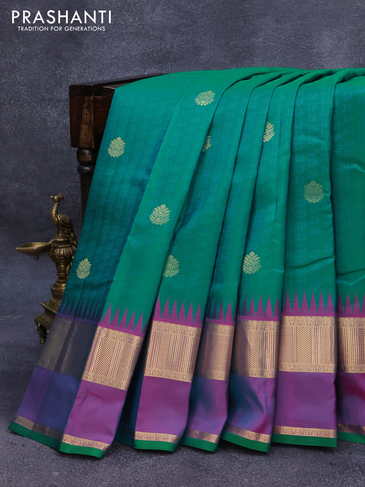 Pure kanjivaram silk saree dual shade of teal green and dual shade of purple with allover self emboss & zari buttas and temple design rettapet zari woven border