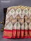 Pochampally tissue silk saree cream brown and kumkum red with allover ikat weaves and zari woven border