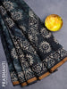Muslin cotton saree dark bottle green with allover tie and dye & batik butta prints and small zari woven border