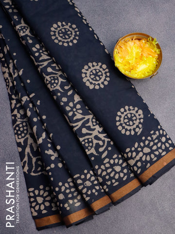 Muslin cotton saree black with allover batik prints and small zari woven border