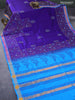Silk cotton block printed saree blue and cs blue with allover prints and zari woven border
