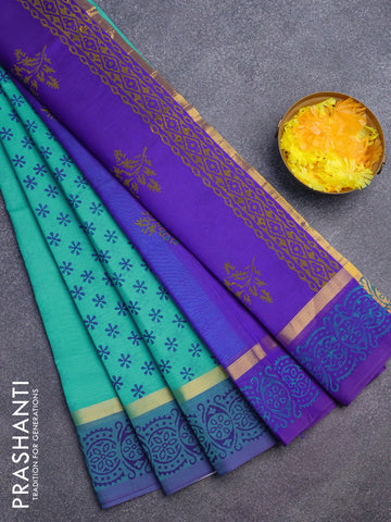 Silk cotton block printed saree teal blue and blue with allover floral butta prints and zari woven simple border