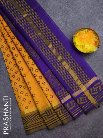 Silk cotton block printed saree yellow and blue with allover prints and zari woven simple border