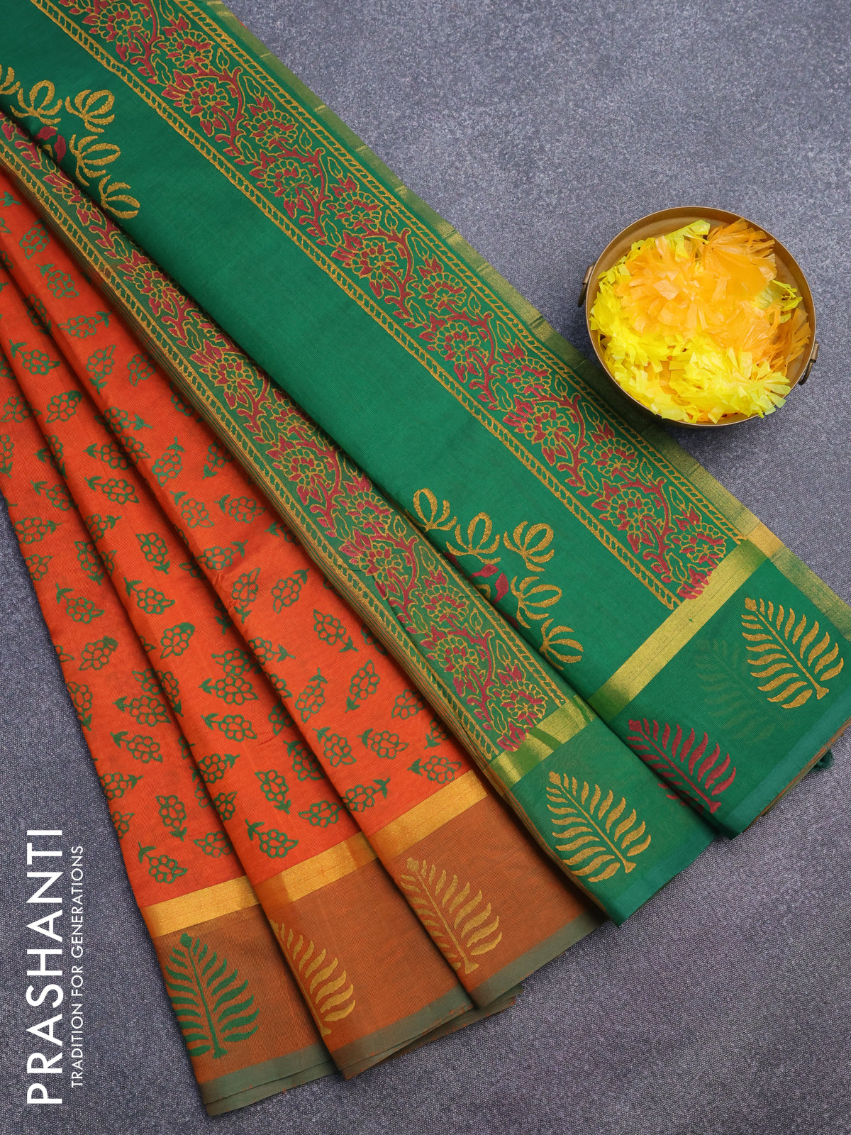 Silk cotton block printed saree orange and green with allover floral butta prints and zari woven simple border