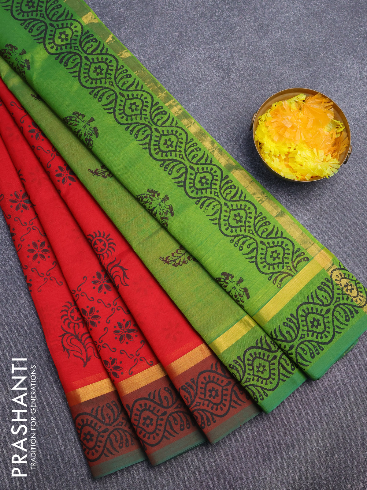 Silk cotton block printed saree red and green with allover floral prints and zari woven simple border