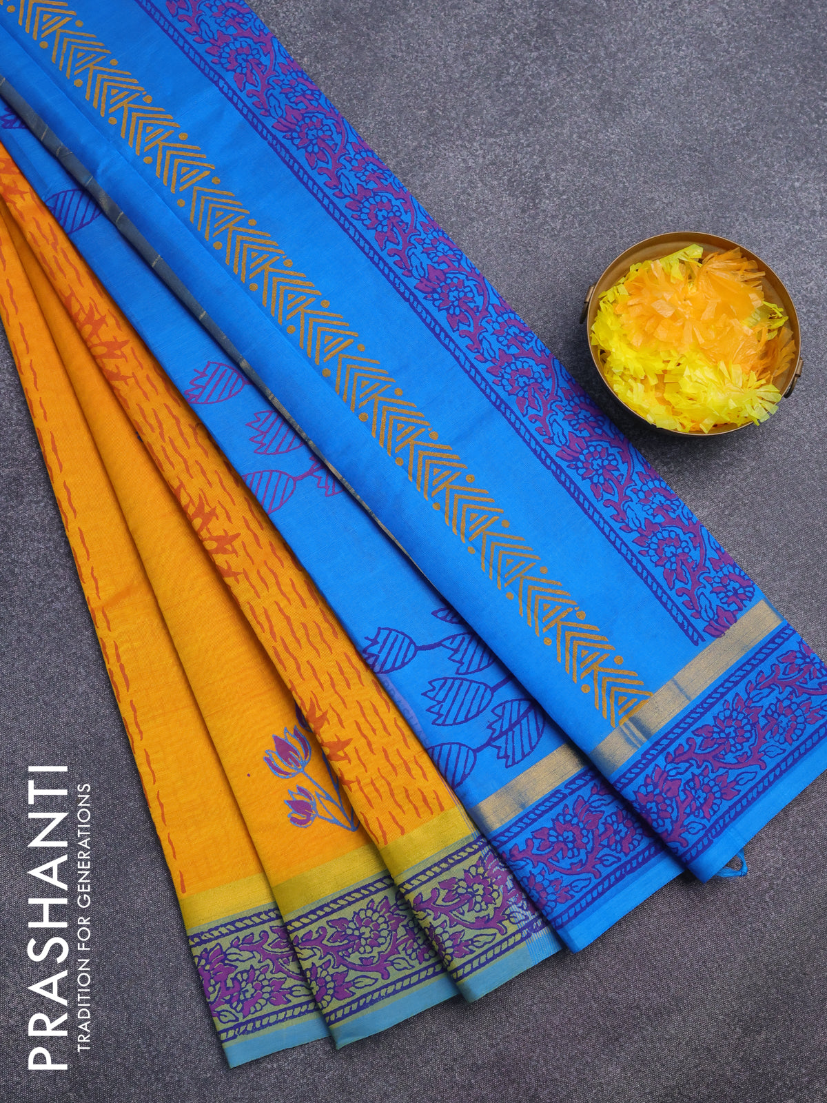 Silk cotton block printed saree mustard yellow and cs blue with allover prints and zari woven simple border