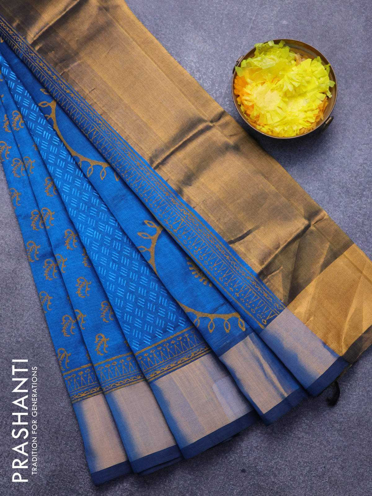 Silk cotton block printed saree peacock blue with allover prints and zari woven border