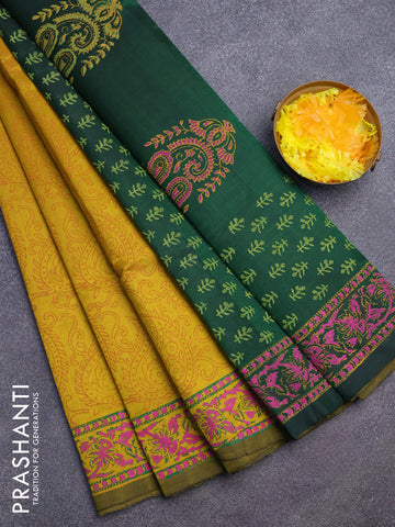 Silk cotton block printed saree dark mustard and green with allover prints and printed border