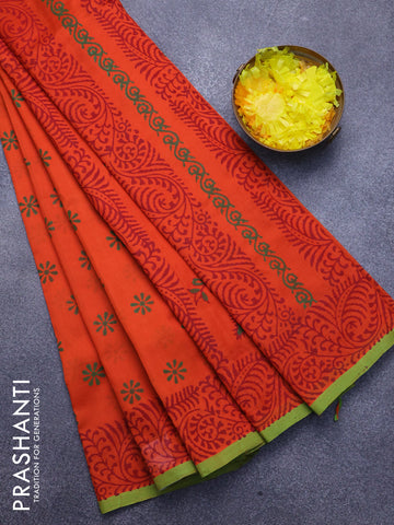 Silk cotton block printed saree orange and light green with allover floral butta prints and printed border