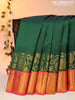 Pure kanjivaram silk saree green and orange with plain body and floral design zari woven border