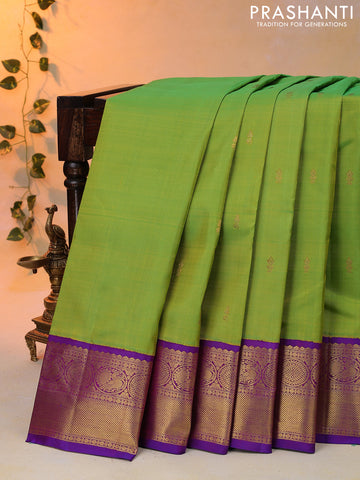 Pure kanjivaram silk saree light green and violet with zari woven buttas and zari woven korvai border