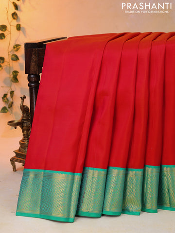Pure kanjivaram silk saree orange and green with plain body and zari woven border