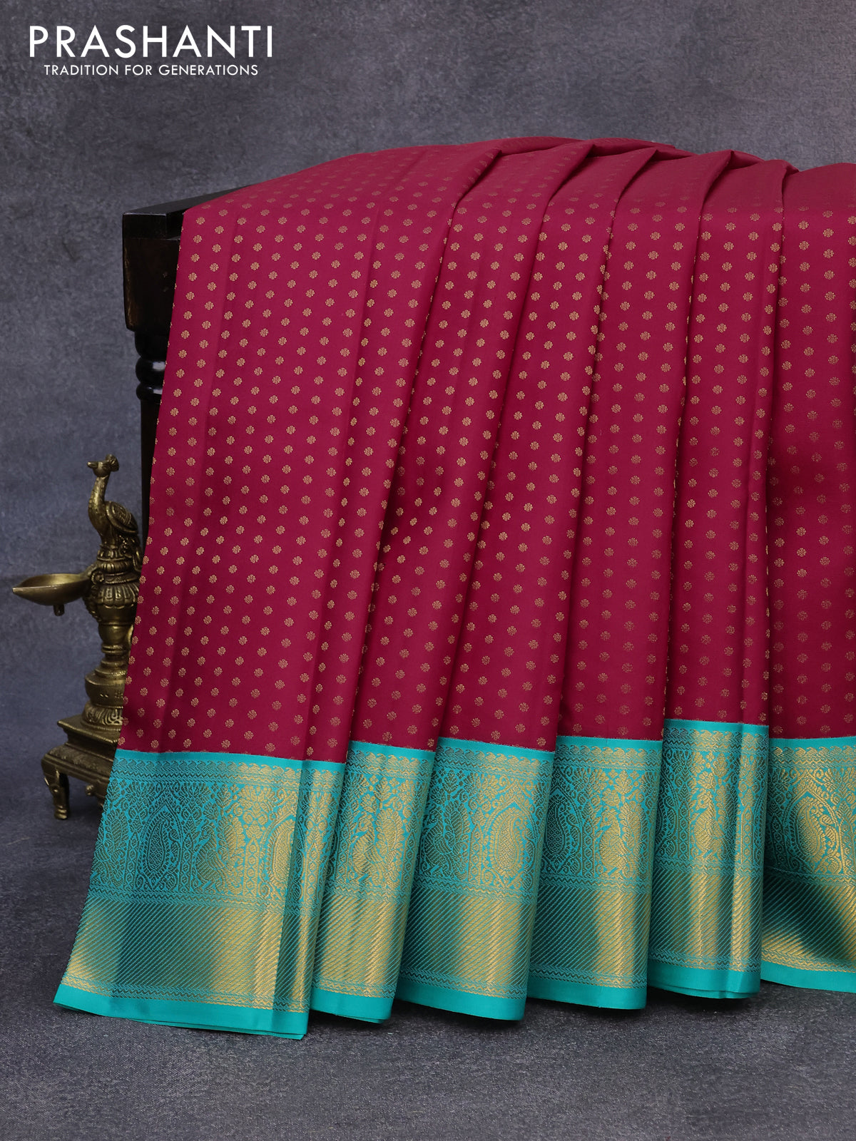 Pure kanjivaram silk saree reddish pink and teal blue with allover zari woven butta weaves and zari woven korvai border