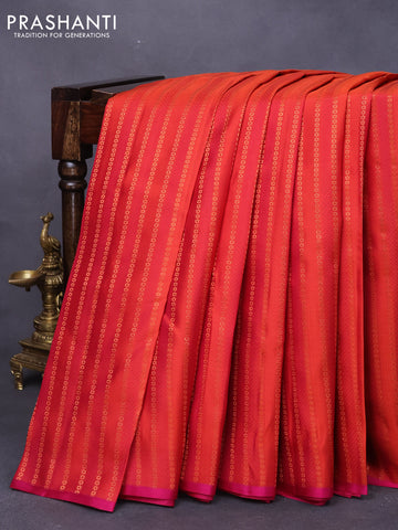 Pure kanjivaram silk saree orange and pink with allover self emboss & copper zari weaves and thread woven piping border
