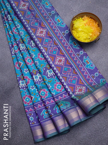 Semi tussar saree dual shade of teal blue and dual shade violet with allover patola prints and ikat woven zari border