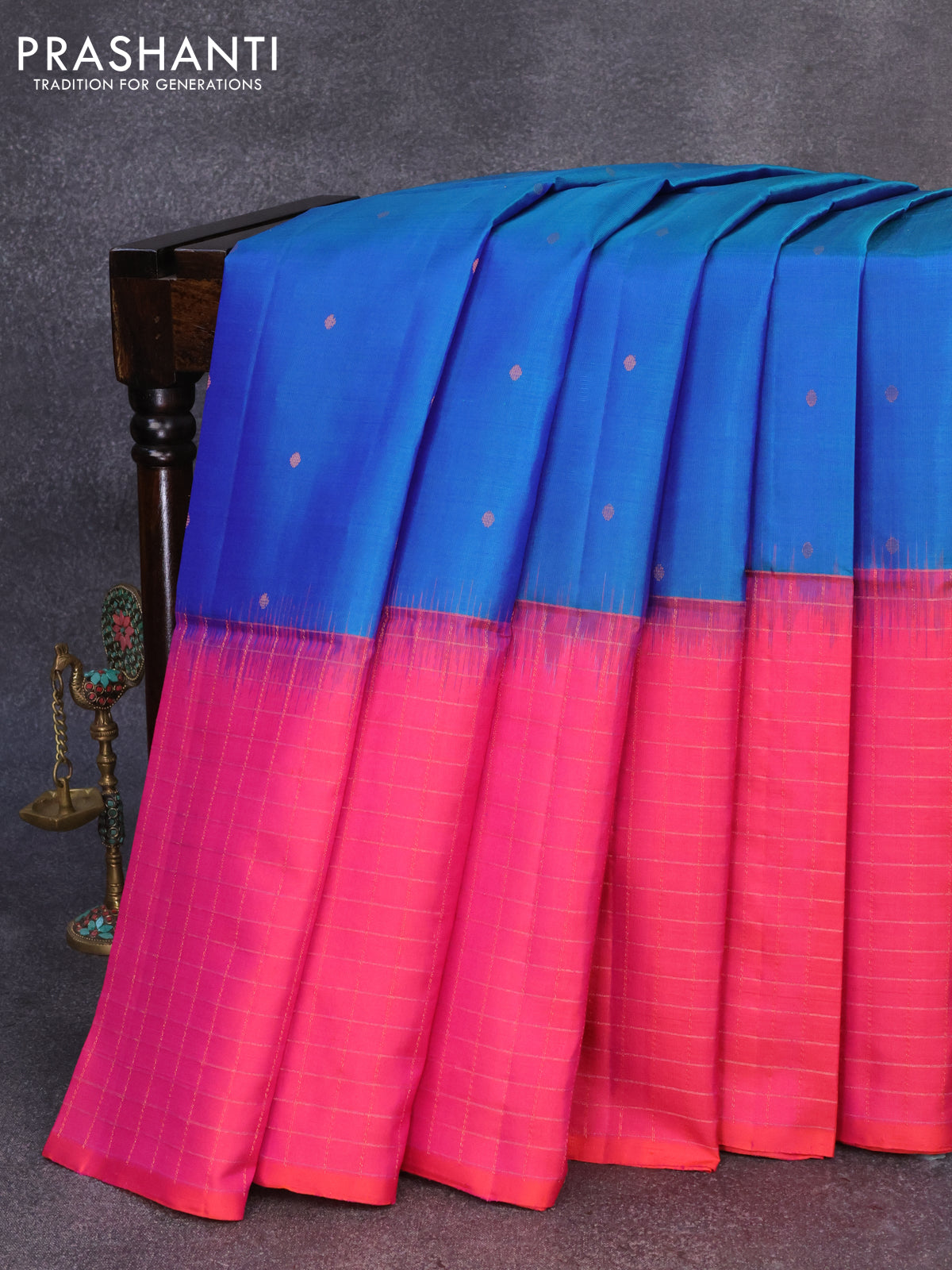 Pure soft silk saree dual shade of blue and dual shade of pinkish orange with allover zari woven buttas and zari checked border