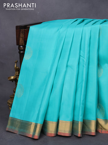 Pure kanjivaram silk saree teal blue and dual shade of pinkish orange with zari woven paisley buttas and zari woven border