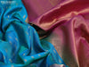 Pure kanjivaram silk saree dual shade of teal blue and purple with allover zari woven buttas and long zari woven border