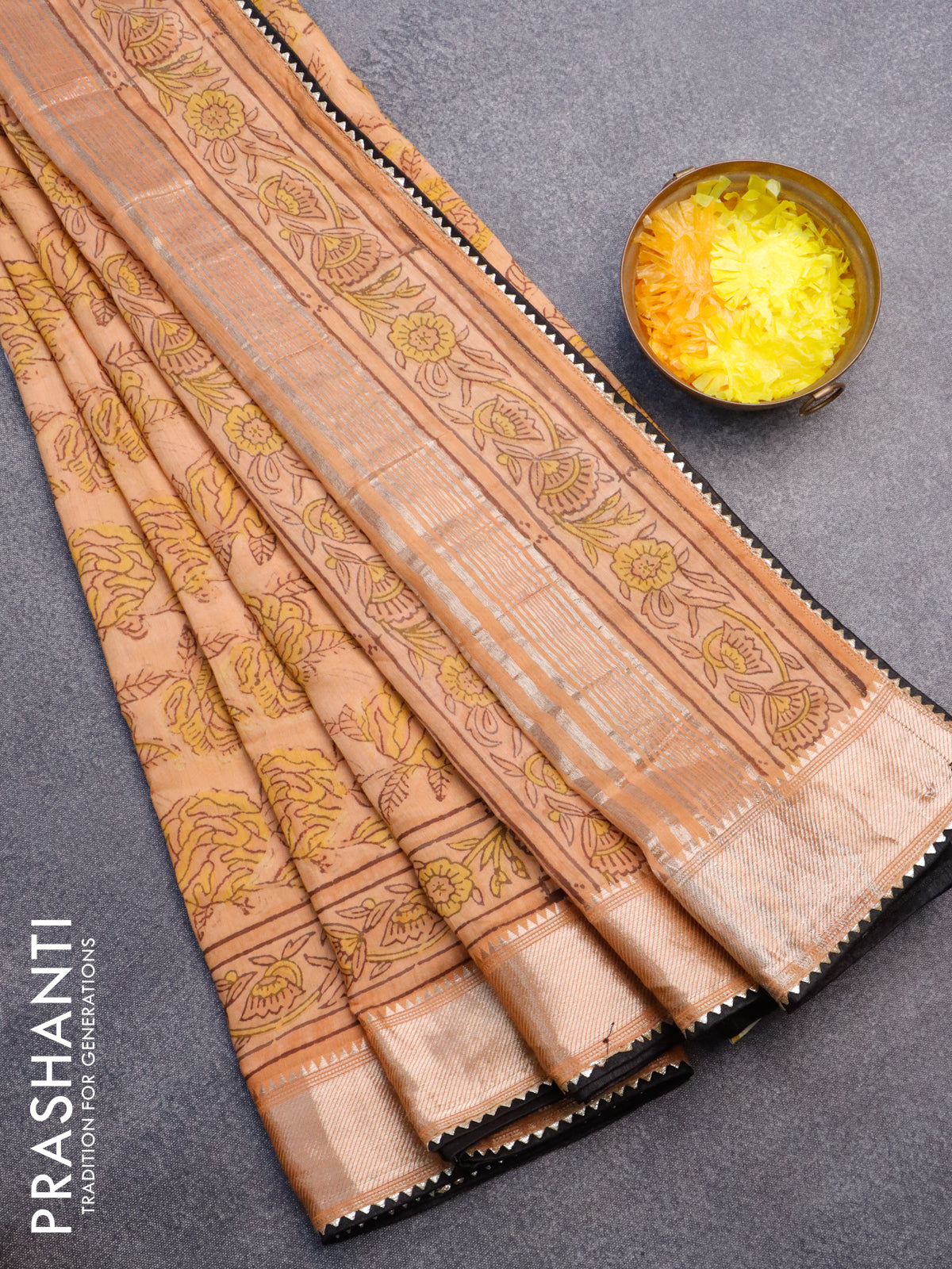 Chanderi silk cotton saree pale orange and black with natural vegetable prints and zari woven gotapatti lace border