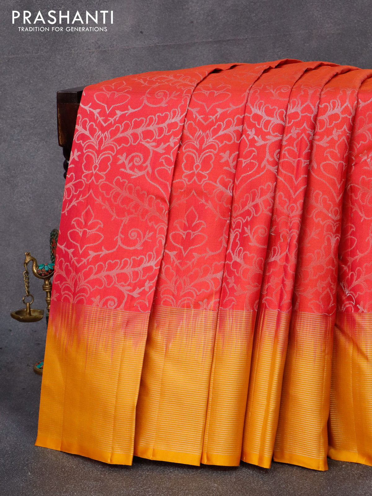 Pure soft silk saree dual shade of pinkish orange and mustard yellow with allover silver zari woven brocade weaves and silver zari woven border