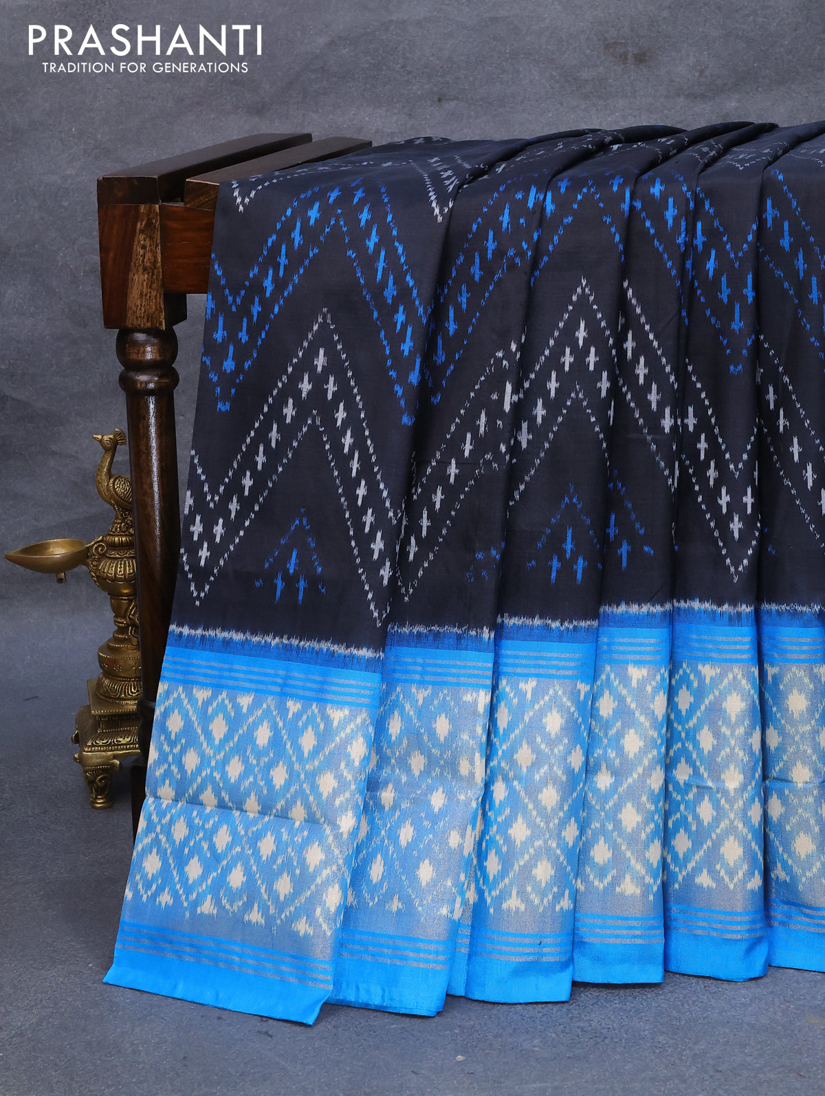 Pochampally silk saree black and cs blue with allover ikat weaves and long ikat woven zari border