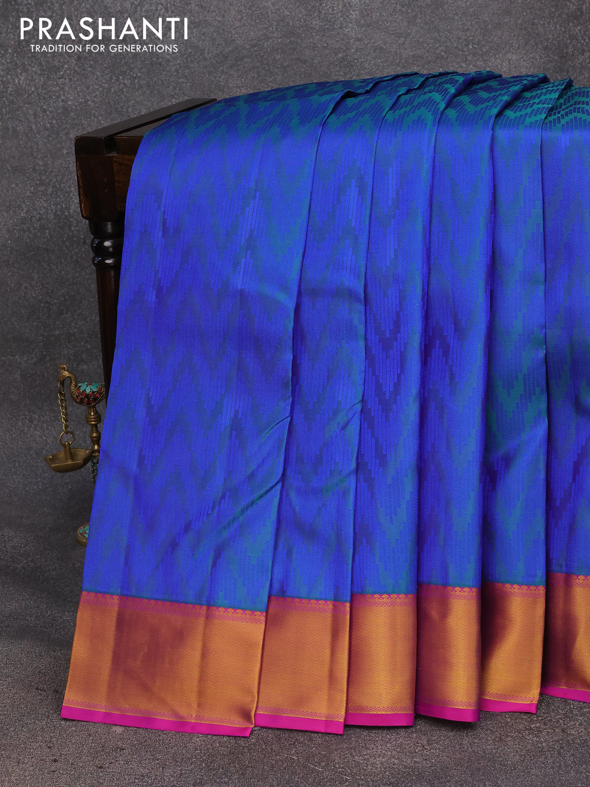 Pure kanjivaram silk saree dual shade of peacock blue and magenta pink with allover thread woven zig zag weaves and zari woven border