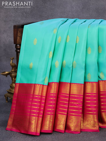 Pure kanjivaram silk saree dual shade of teal bluish green and pink with allover zari woven annam buttas and long rich zari woven korvai border butta style