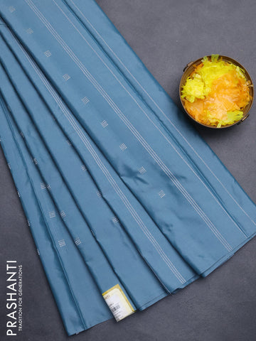 Arani semi silk saree blue shade with silver zari woven buttas in borderless style