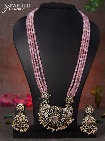 Beaded multi layer baby pink necklace peacock design with cz stones and beads hanging in victorian finish