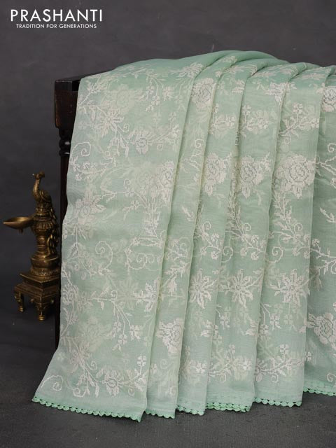 Chanderi tissue saree pastel green with allover embroidery and lace work border