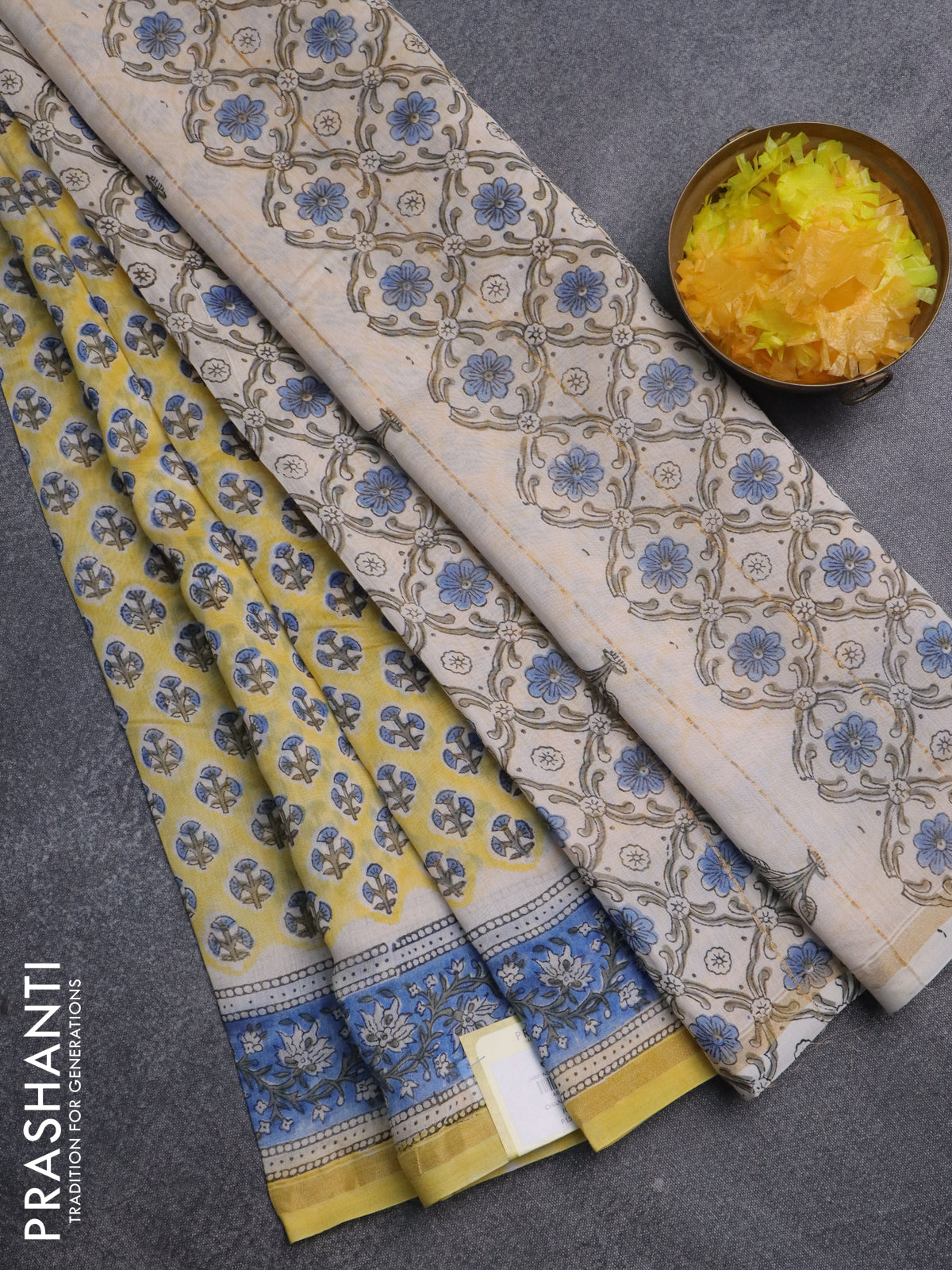 Chanderi bagru saree pale yellow and blue with allover floral butta prints and small zari woven border