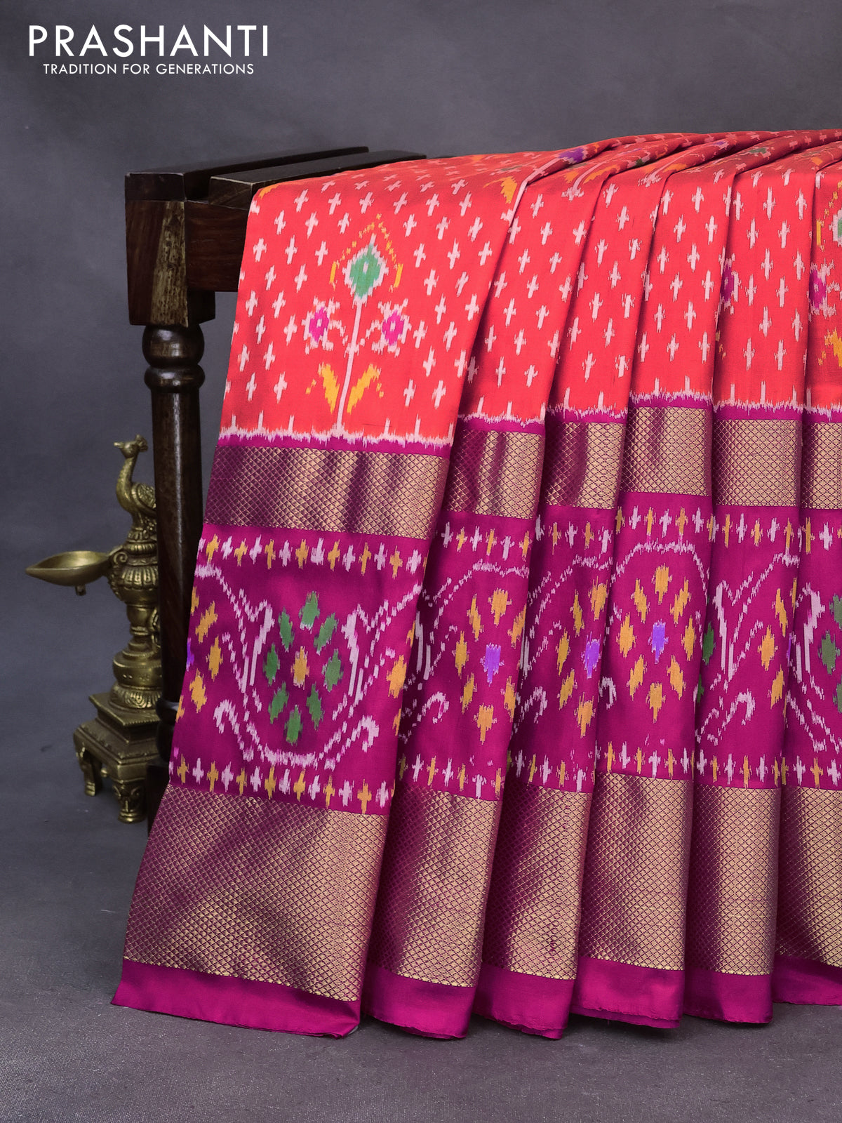 Pochampally silk saree orange and pink with allover ikat weaves and long zari woven ikat border